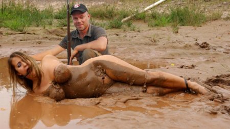 Naked beauties in mud