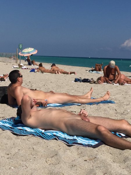 Naked guy on a textile beach