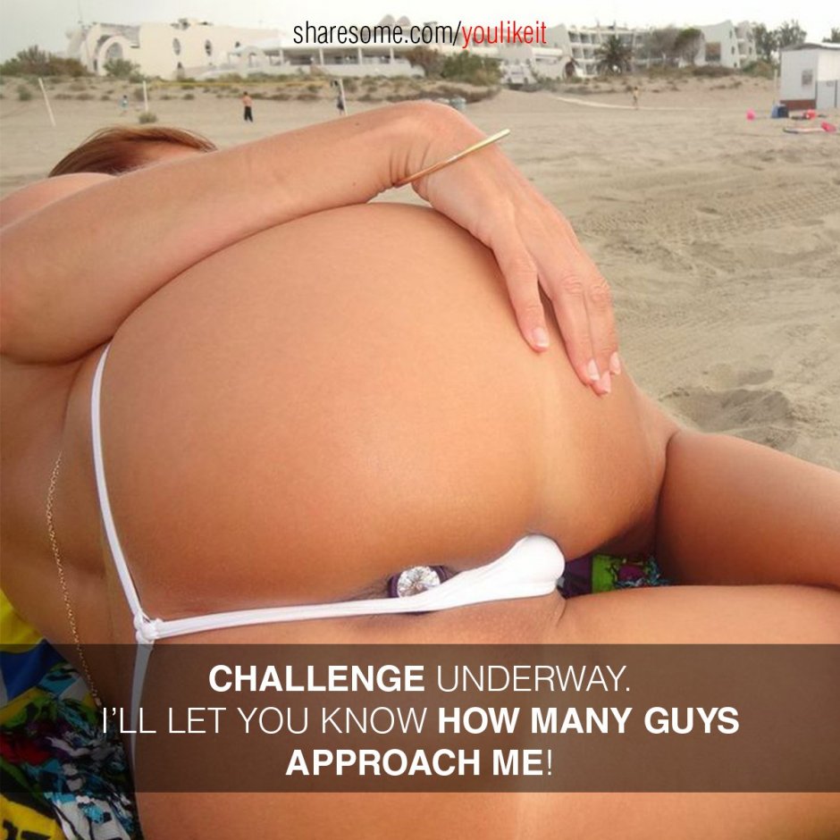 With a naked ass in thong on the beach