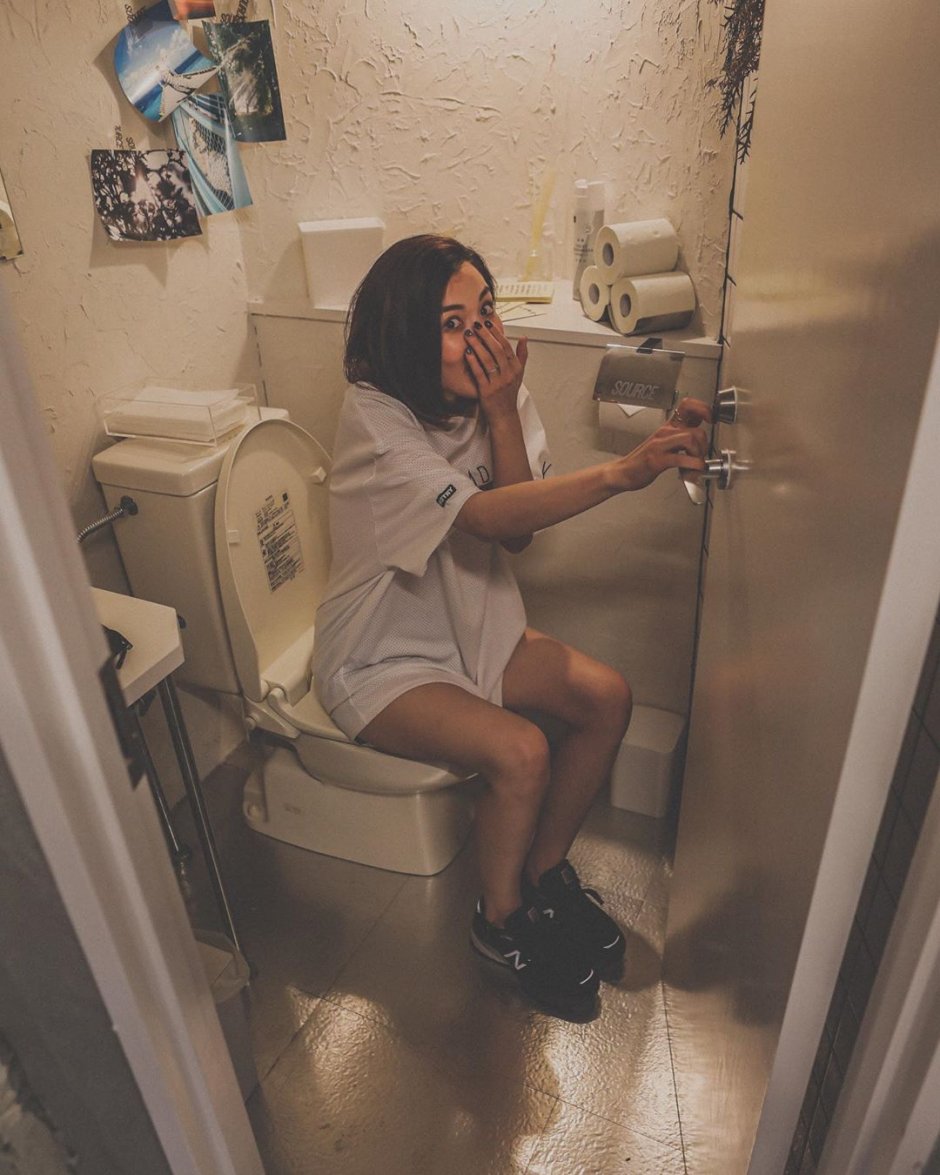 Teenage pissing in the toilet