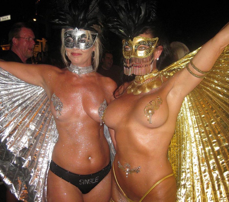 Naked women in carnival costumes