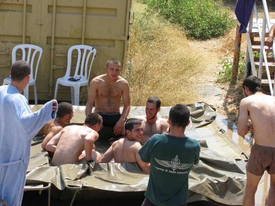 Naked guy opposite the crowd of Israel soldiers