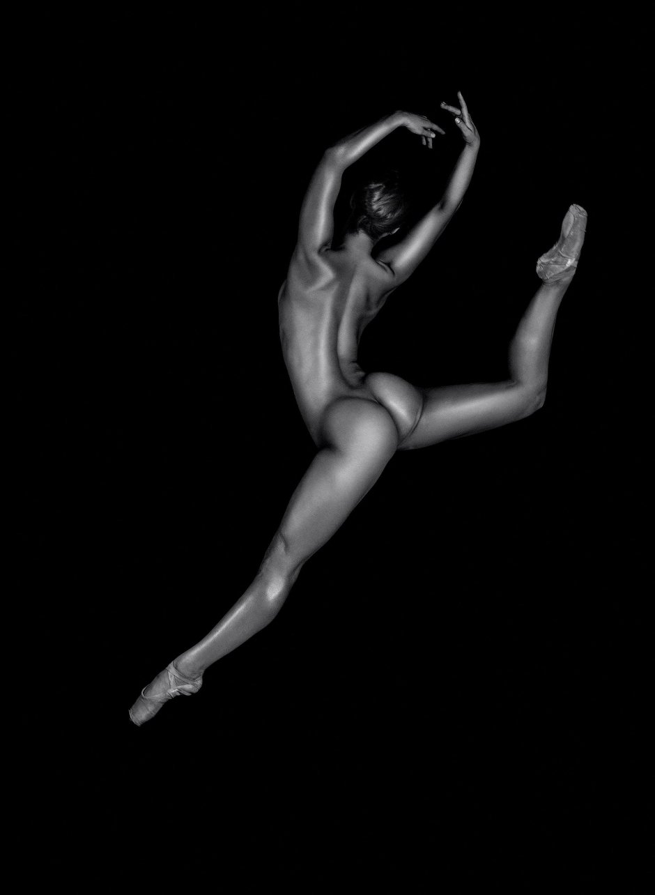 A naked stripper is dancing