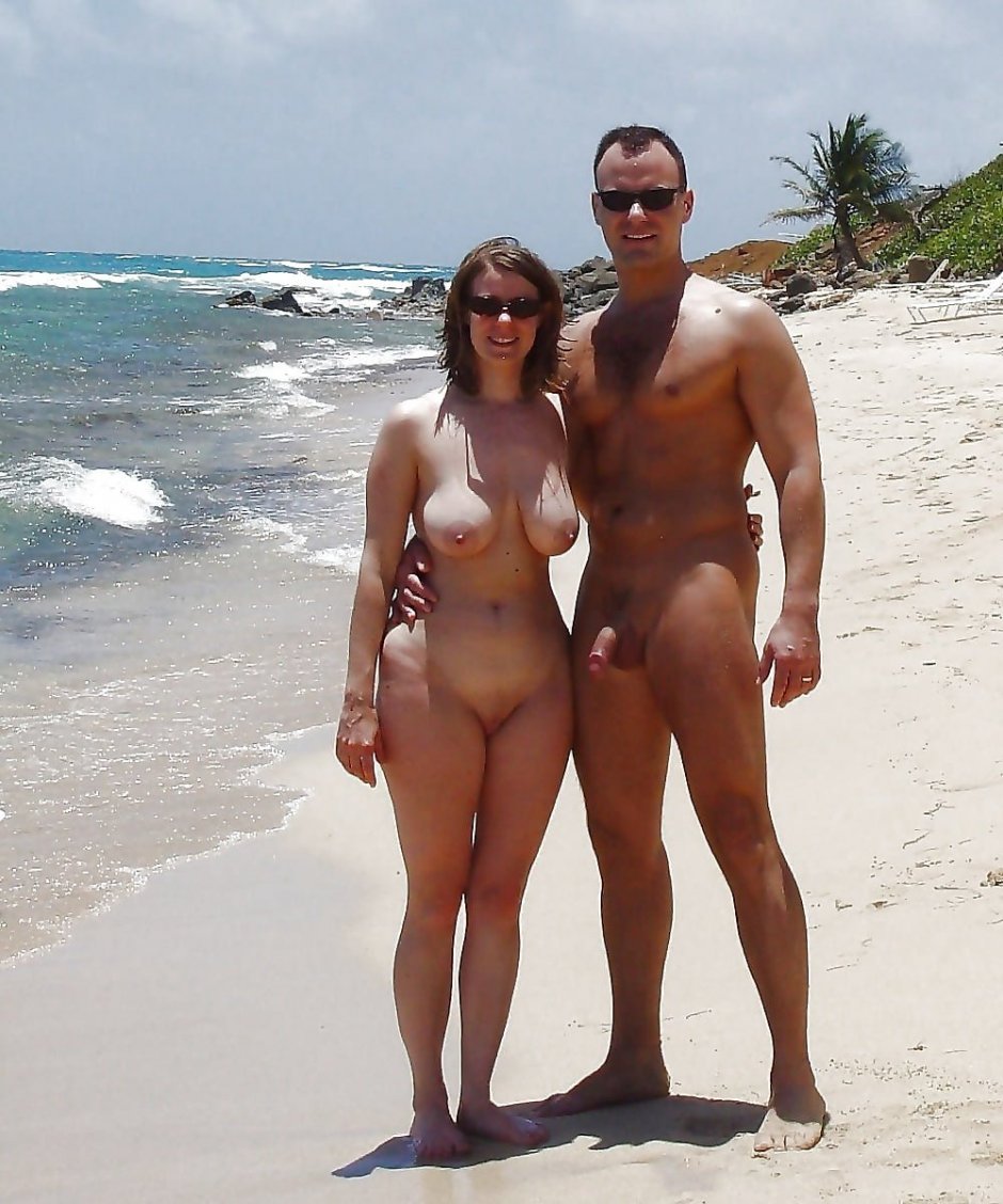 Naked men and women on the beach