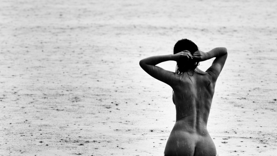 Naked beauties in the rain