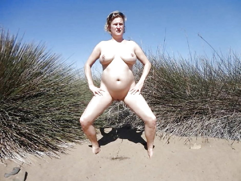 Pregnant nudist on the beach