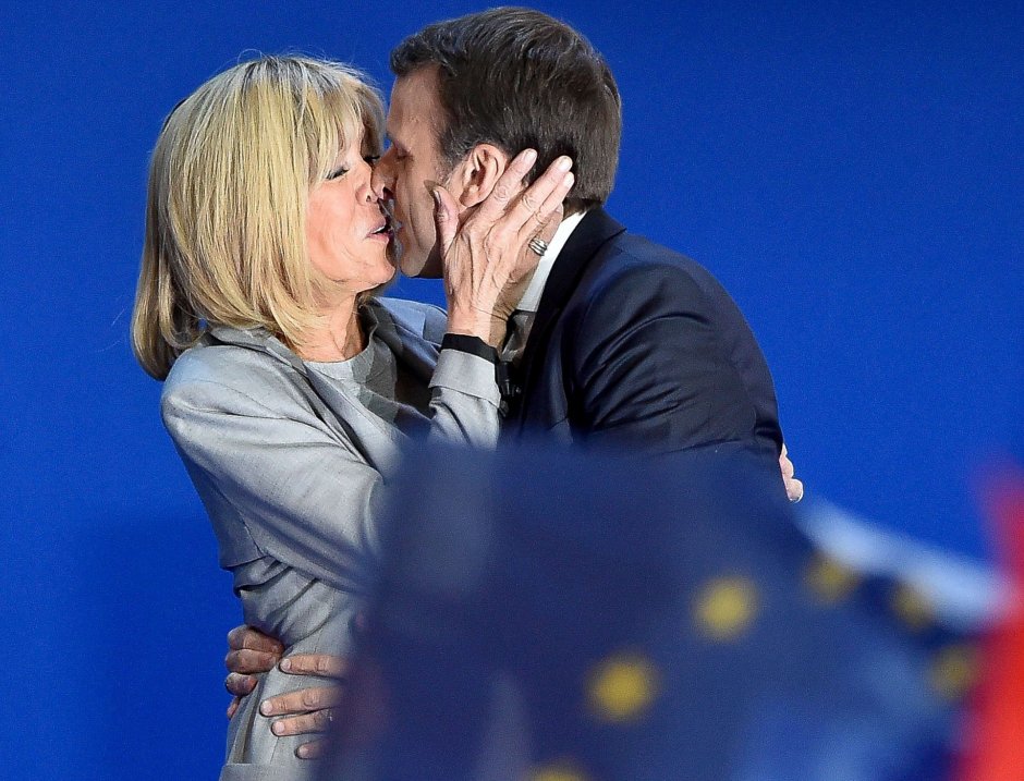 Macron sits