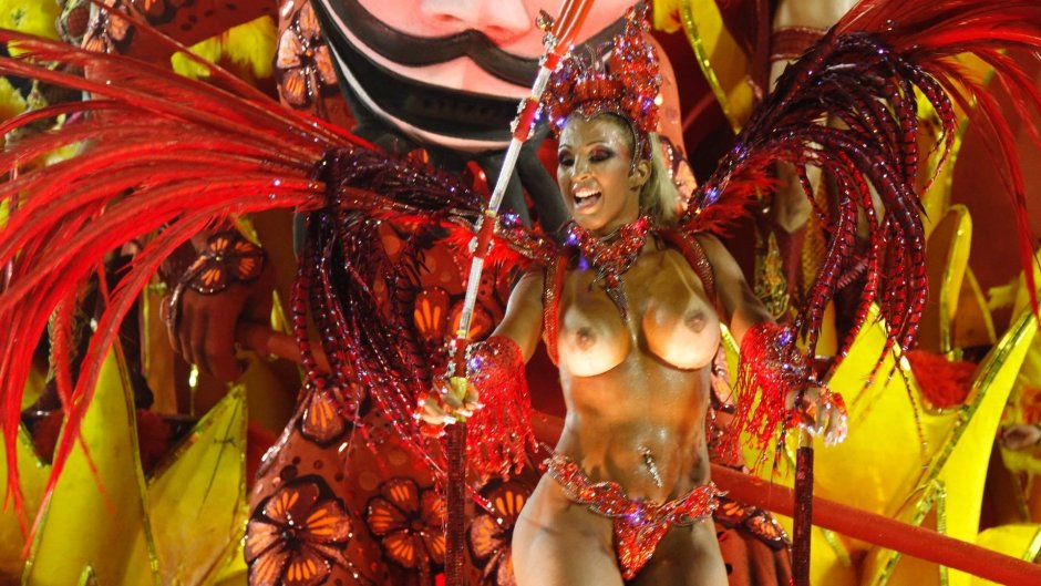 Naked women in carnival costumes