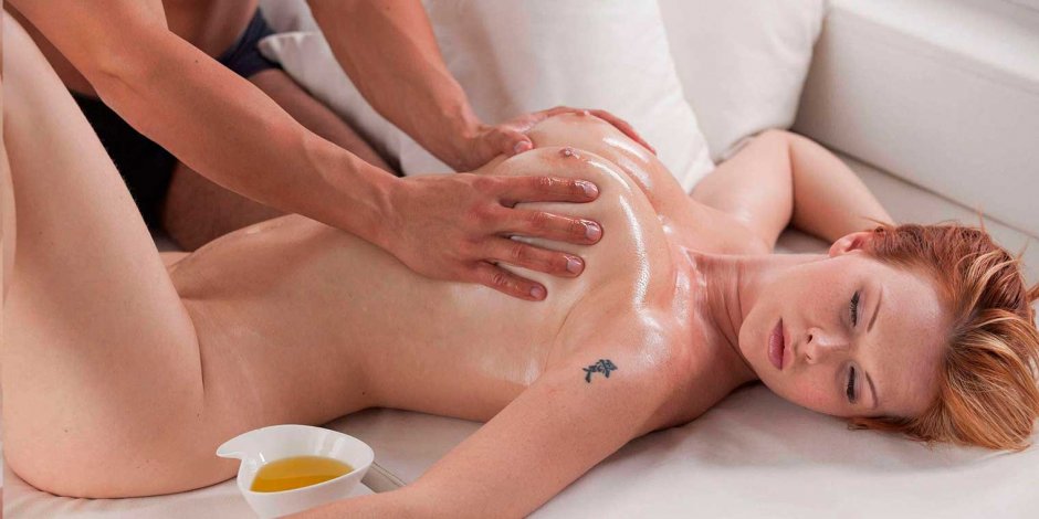 Massage of naked female breasts
