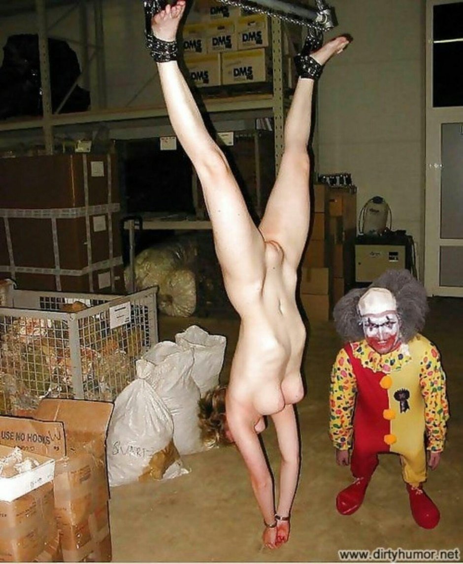 The naked woman was hung by the leg