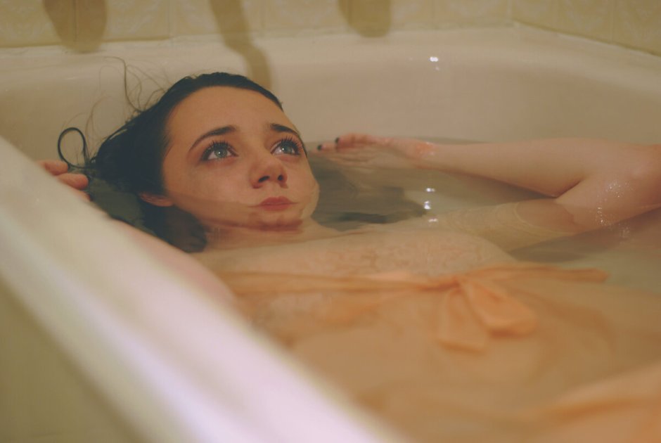 Girl swimming in the bathroom