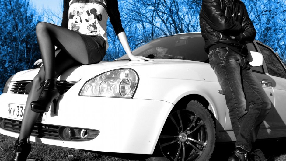 A guy with a girl near a car