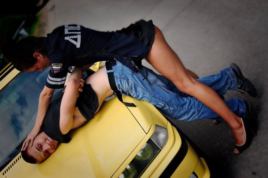 The policeman searches the girl