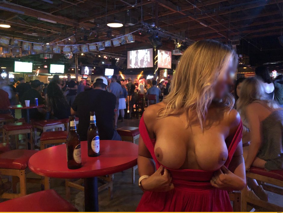 Girls show boobs in a cafe