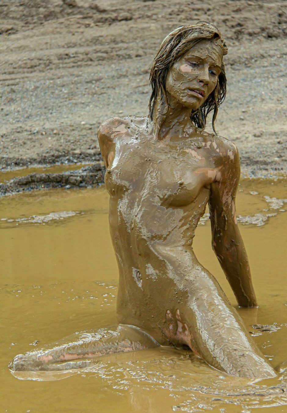 Naked brunettes in mud