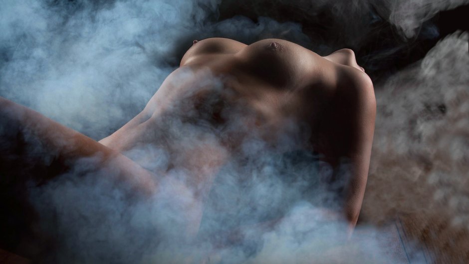 Naked woman in smoke boobs