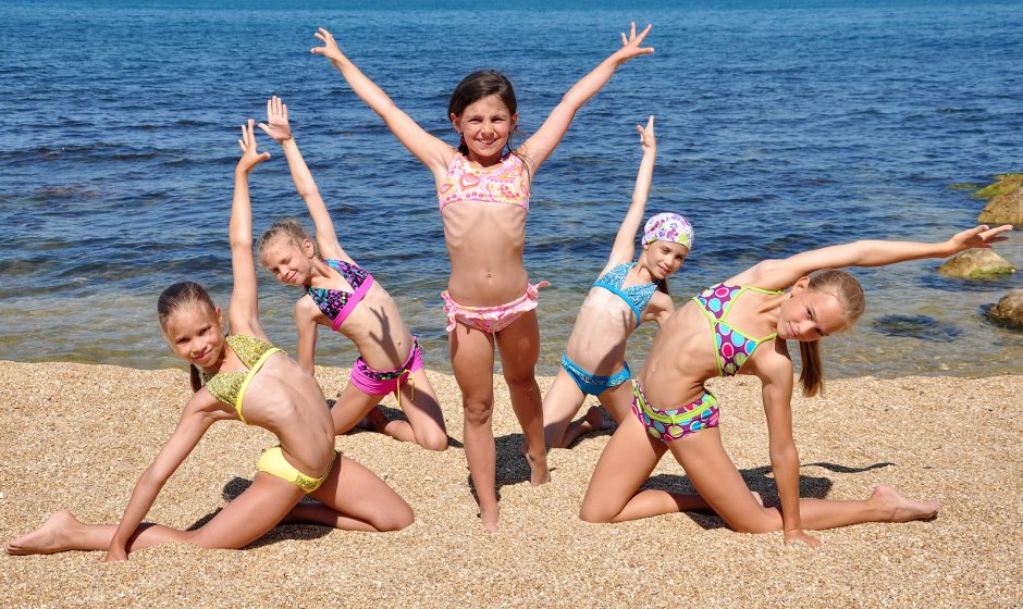 Gymnasts on the beach