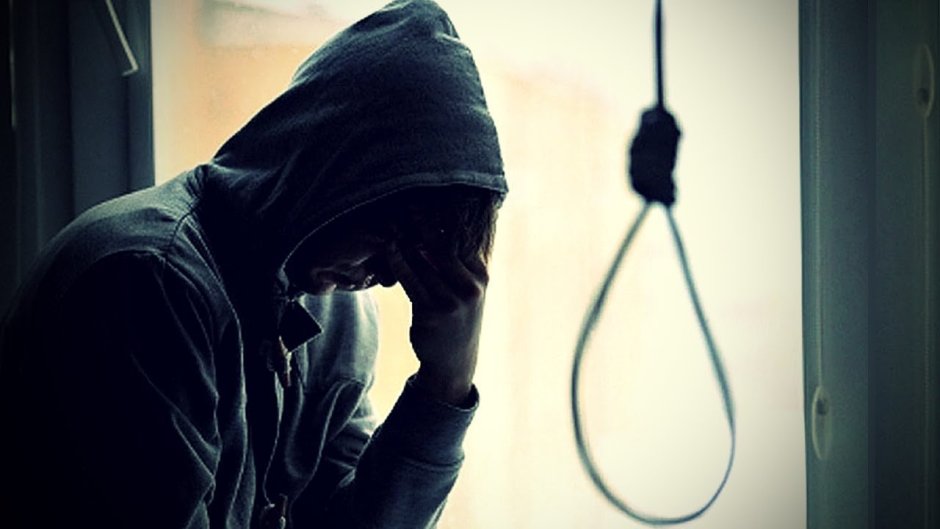 A teenager in a hood