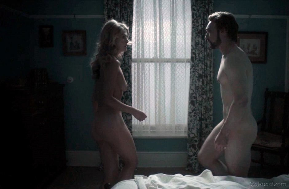Rosamund ration naked in front of the mirror