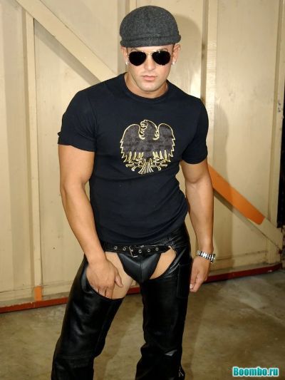 An appetizing guy is dancing a striptease.