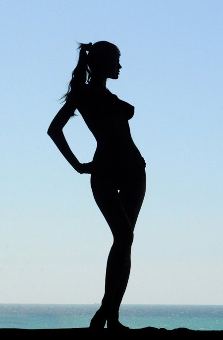 Silhouette of a slender woman photo