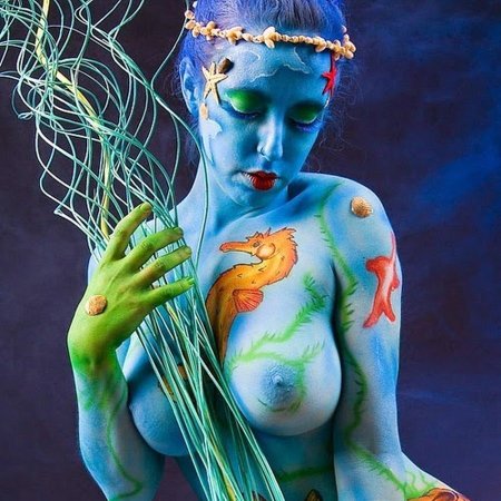Body painting on naked women