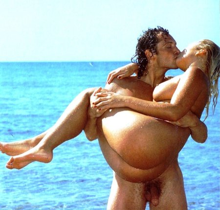 Naked men and women on the beach