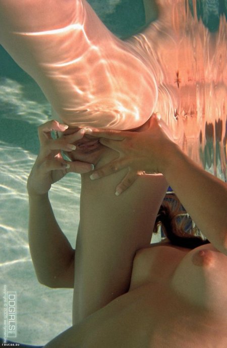 Naked women with fins underwater