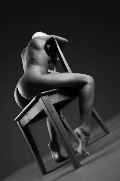 Erotic photo shoot on a chair