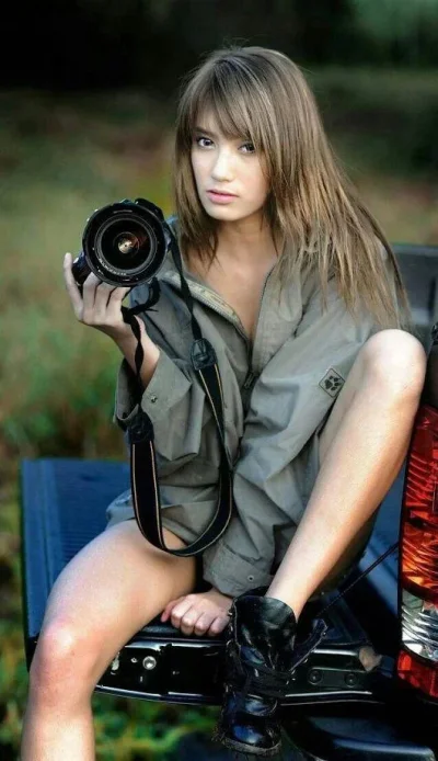 Женщина с фотоаппаратом