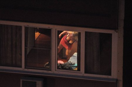 Naked in the windows of neighboring houses