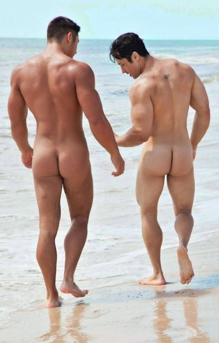 Naked butts of guys on the beach