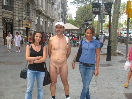 Clothed women and naked men in the street
