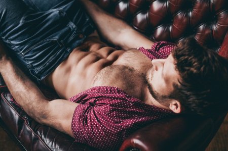 Male abs in bed