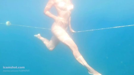 Ekaterina Nekrasova swimming under ice