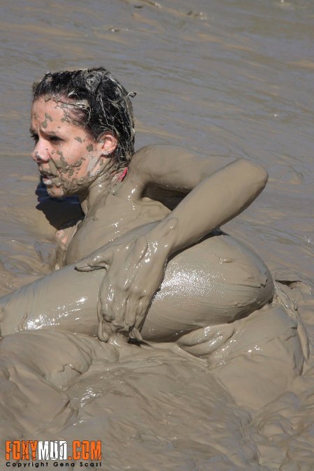Girls bathe in mud