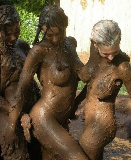 Naked women bathe in mud