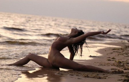 Naked gymnasts on the shore